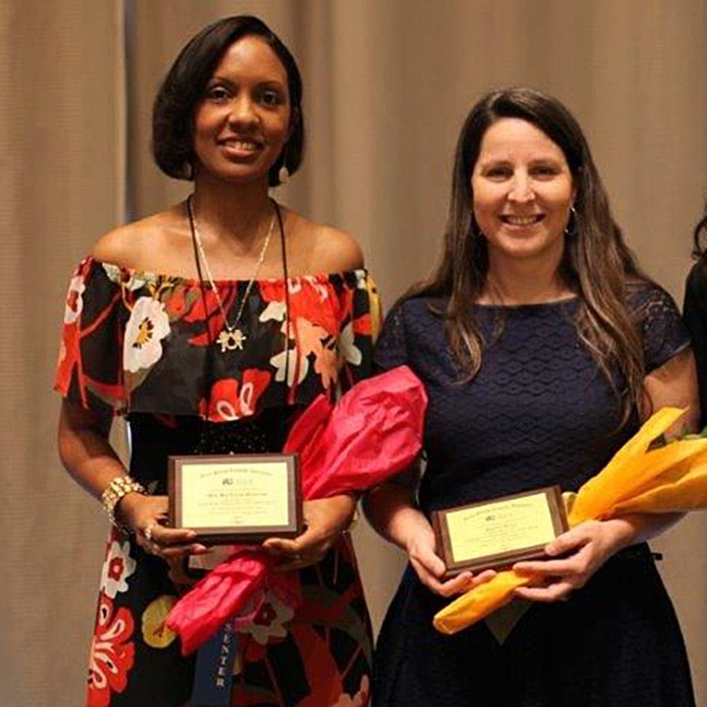 MilyBette Llanos and German teacher Jennifer Melgar hold their awards for Teacher of the Year