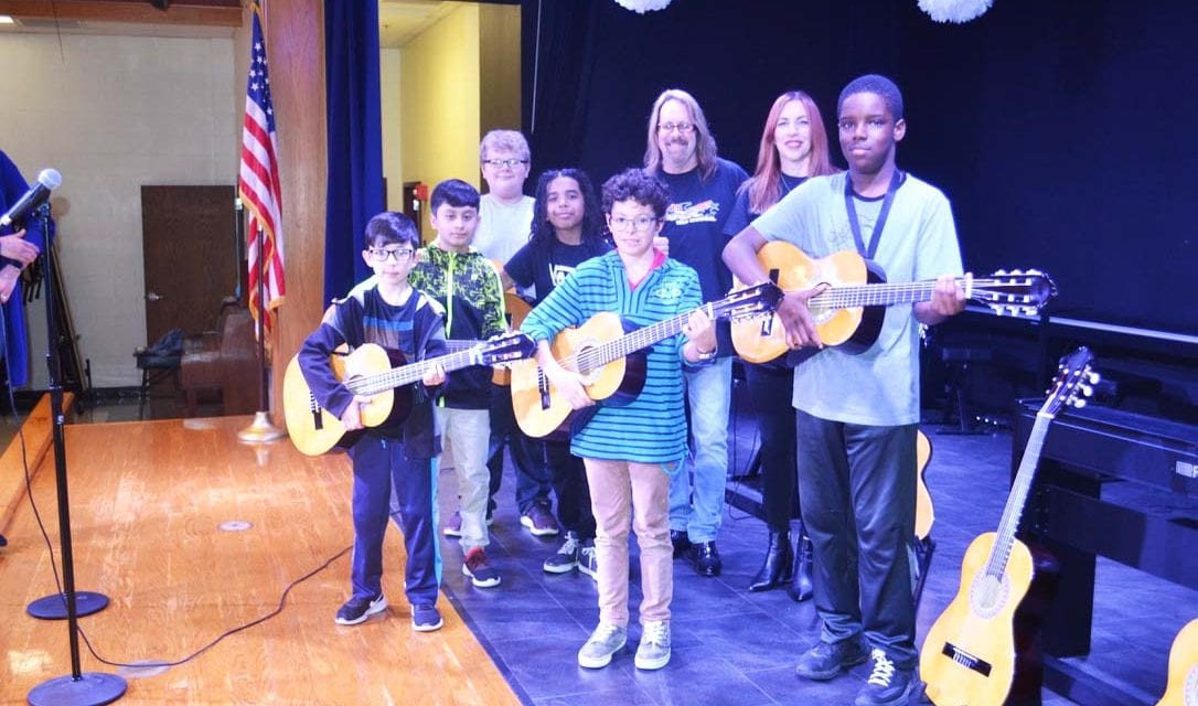 Kids Rock the Nation donates guitars to Berkman Elementary